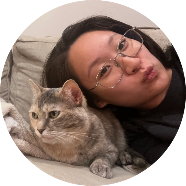 Vanna lying down with her cat